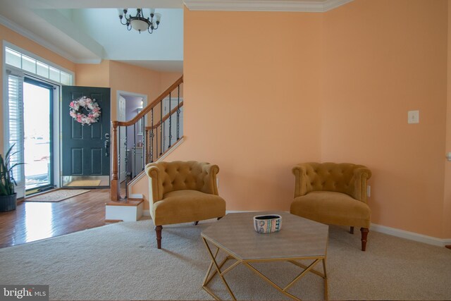 12253 Tulane Falls Dr, Bristow, VA 20136 - carpeted foyer featuring baseboards, crown molding, stairs, and a notable chandelier