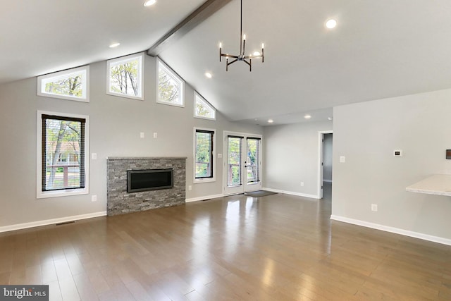 unfurnished living room featuring high vaulted ceiling, baseboards, an inviting chandelier, and beam ceiling