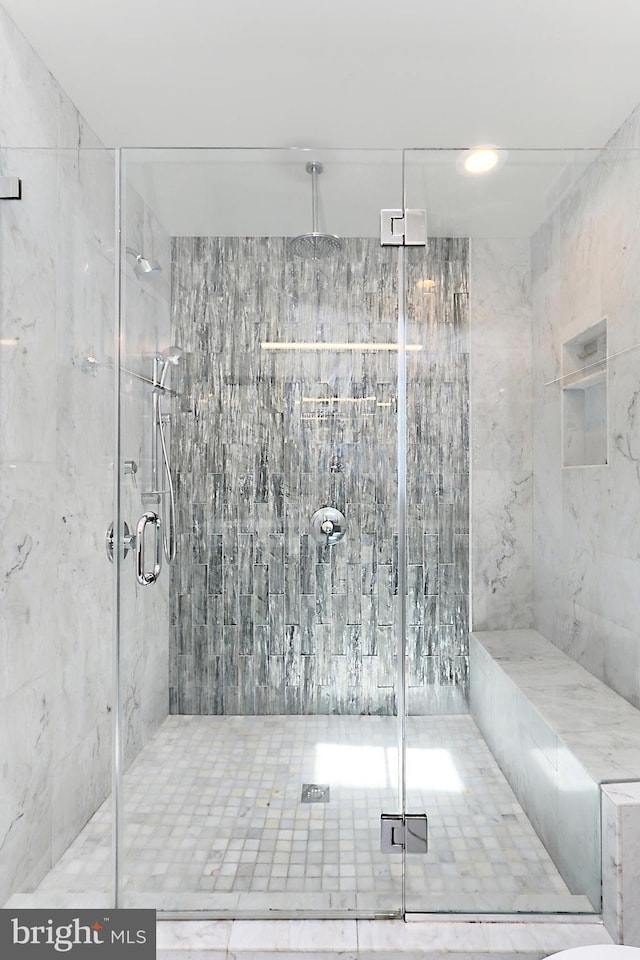 full bathroom with a shower stall