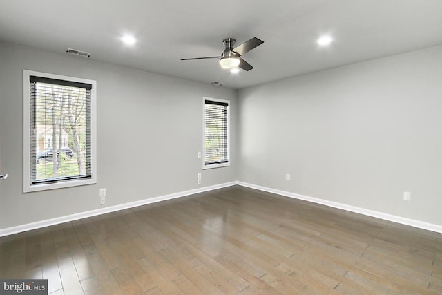 unfurnished room with visible vents, baseboards, a ceiling fan, recessed lighting, and wood finished floors