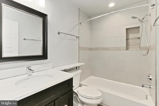 bathroom featuring recessed lighting, bathing tub / shower combination, vanity, and toilet