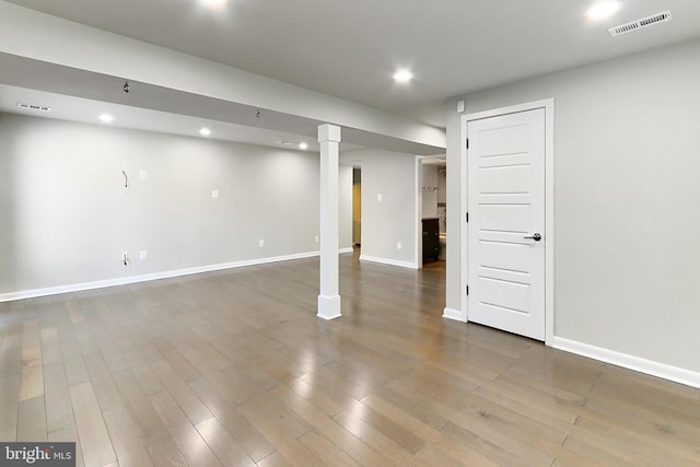 finished basement with visible vents, baseboards, and recessed lighting