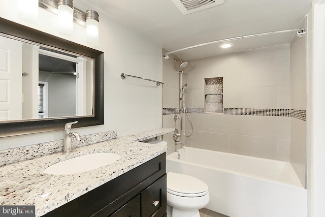 bathroom featuring visible vents, toilet, shower / bathing tub combination, recessed lighting, and vanity
