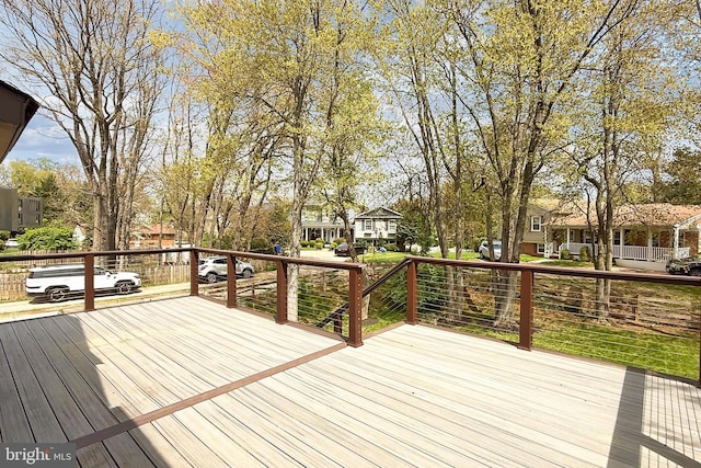 wooden terrace featuring a residential view