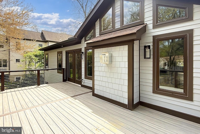 wooden terrace featuring french doors