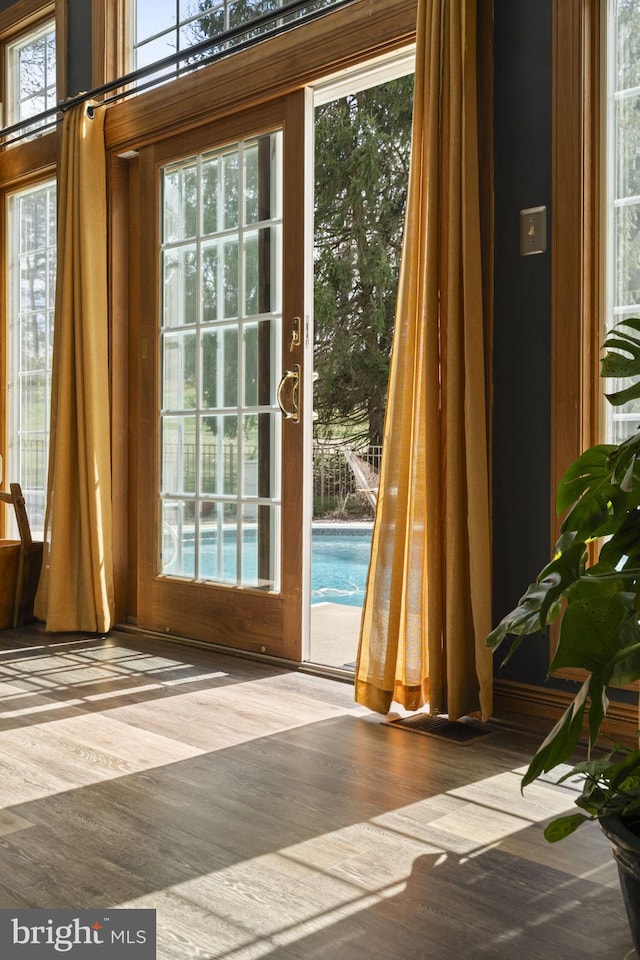 doorway to outside with wood finished floors