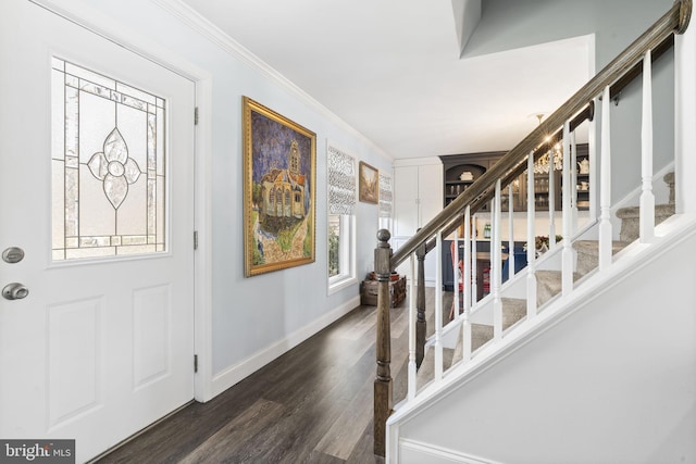 entrance foyer featuring stairway, baseboards, crown molding, and dark wood finished floors