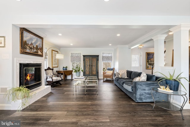 living room with recessed lighting, a fireplace, and wood finished floors