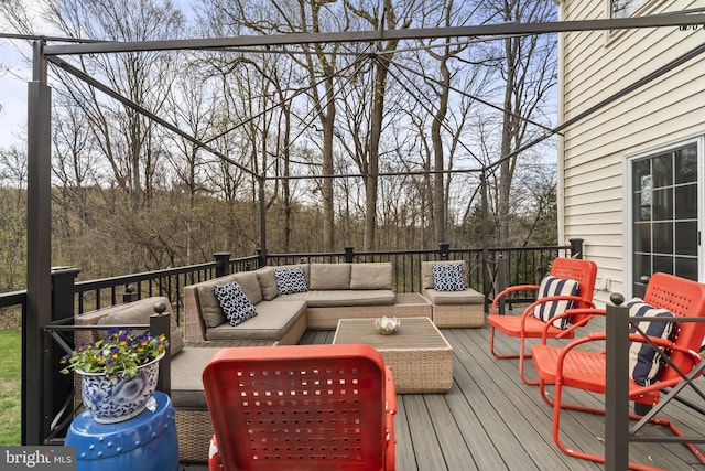 wooden deck featuring an outdoor hangout area