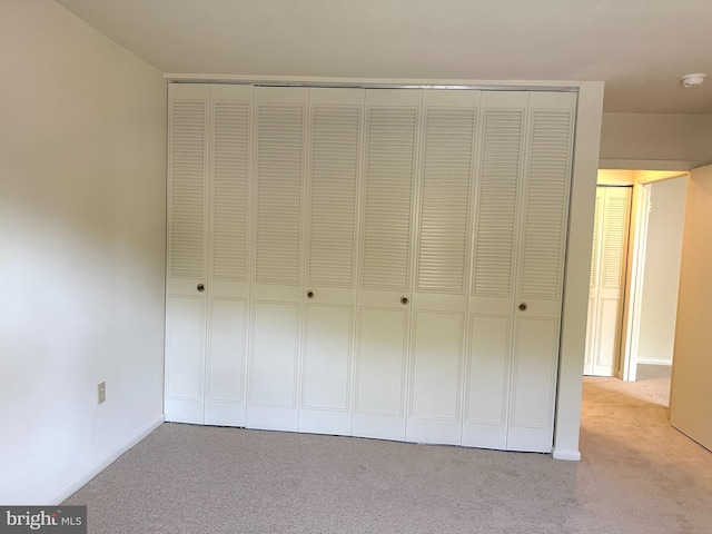 3400 Gleneagles Dr Unit 73-3E, Silver Spring, MD 20906 - unfurnished bedroom featuring carpet floors, a closet, and baseboards