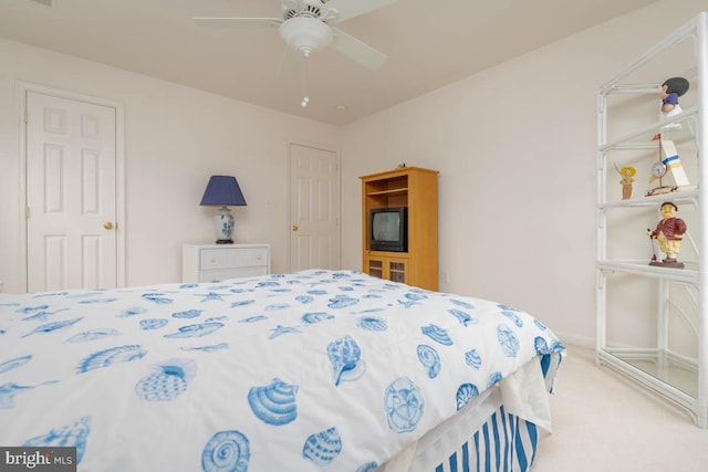 carpeted bedroom with ceiling fan