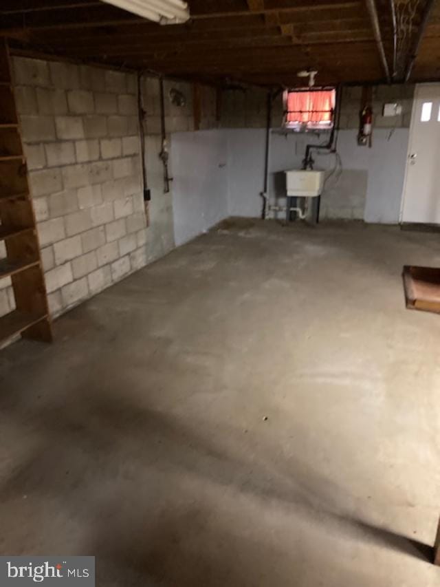 unfinished below grade area with a sink
