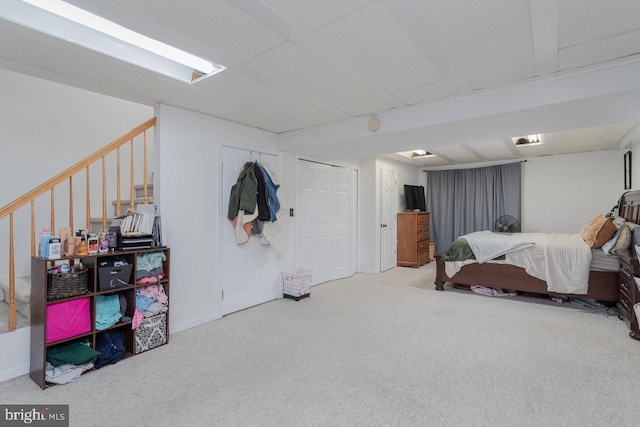 carpeted bedroom featuring baseboards