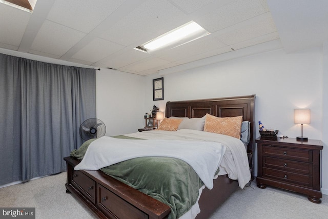 bedroom featuring light colored carpet