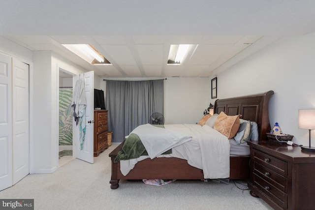 bedroom featuring light colored carpet