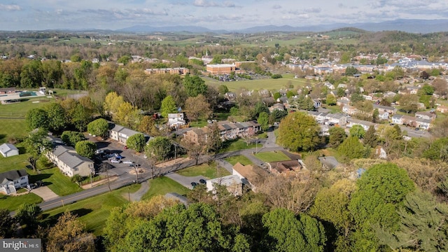 birds eye view of property with a mountain view and a residential view