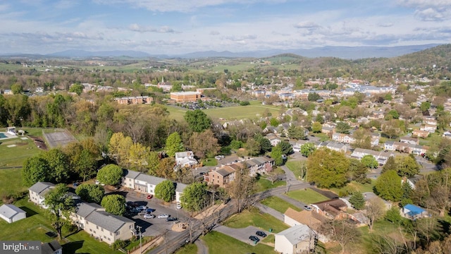 birds eye view of property with a mountain view