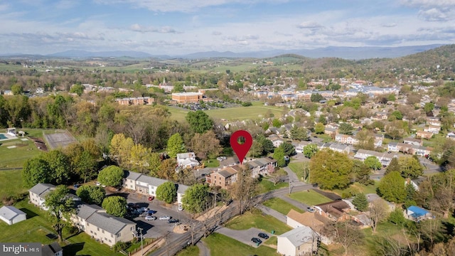 birds eye view of property with a mountain view