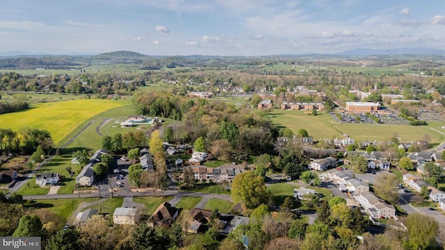 birds eye view of property featuring a mountain view