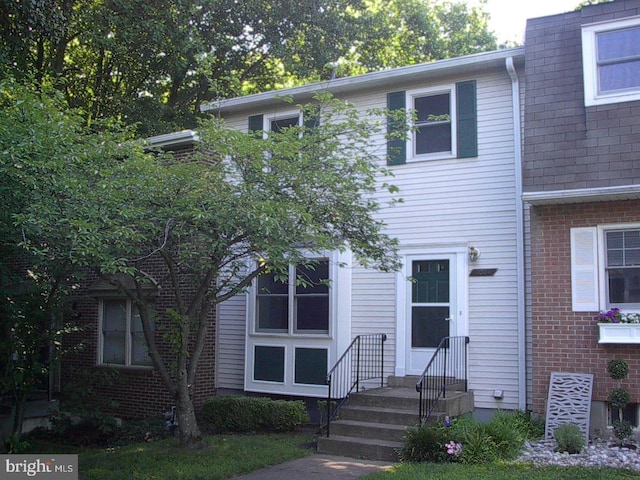 view of property with brick siding