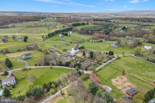 birds eye view of property with a rural view