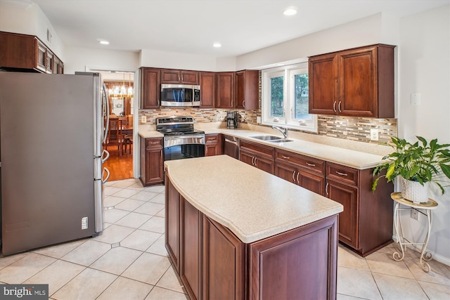 3430 Valewood Dr, Oakton, VA 22124 - kitchen with tasteful backsplash, appliances with stainless steel finishes, a sink, and a kitchen island