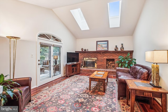 3430 Valewood Dr, Oakton, VA 22124 - living room with high vaulted ceiling, a fireplace, wood finished floors, and a skylight