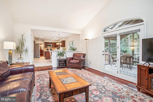 3430 Valewood Dr, Oakton, VA 22124 - living area with a chandelier, light wood finished floors, baseboards, and recessed lighting