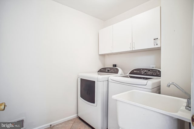 3430 Valewood Dr, Oakton, VA 22124 - washroom with baseboards, light tile patterned floors, independent washer and dryer, cabinet space, and a sink