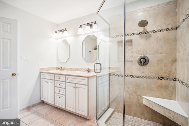 3430 Valewood Dr, Oakton, VA 22124 - bathroom featuring a shower stall, tile patterned floors, double vanity, and a sink