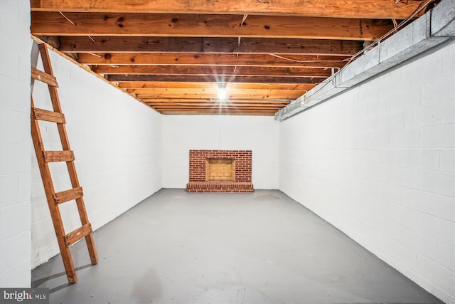 3430 Valewood Dr, Oakton, VA 22124 - unfinished basement featuring a brick fireplace and concrete block wall