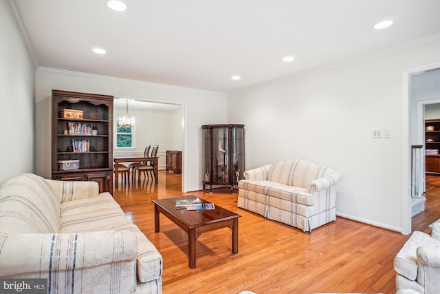 3430 Valewood Dr, Oakton, VA 22124 - living room featuring ornamental molding, an inviting chandelier, and light wood-style floors