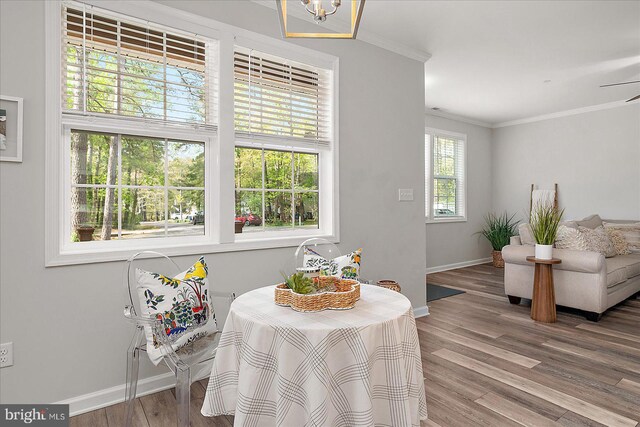 2 Rabbit Run Ln, Ocean Pines, MD 21811 - dining area with a chandelier, wood finished floors, ornamental molding, and baseboards