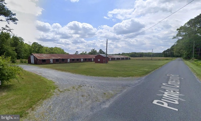 view of road with an outbuilding