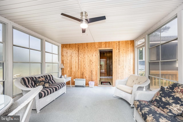 sunroom featuring ceiling fan