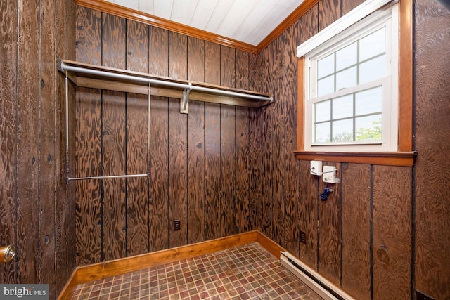 washroom with ornamental molding, laundry area, and wood walls