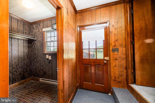 interior space featuring crown molding, wooden walls, and a wealth of natural light
