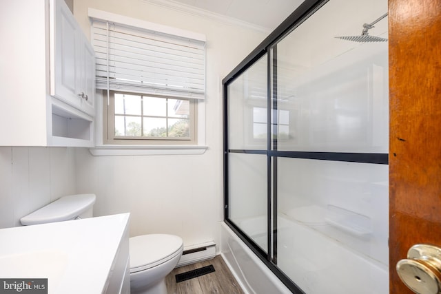 bathroom with visible vents, wood finished floors, vanity, combined bath / shower with glass door, and toilet