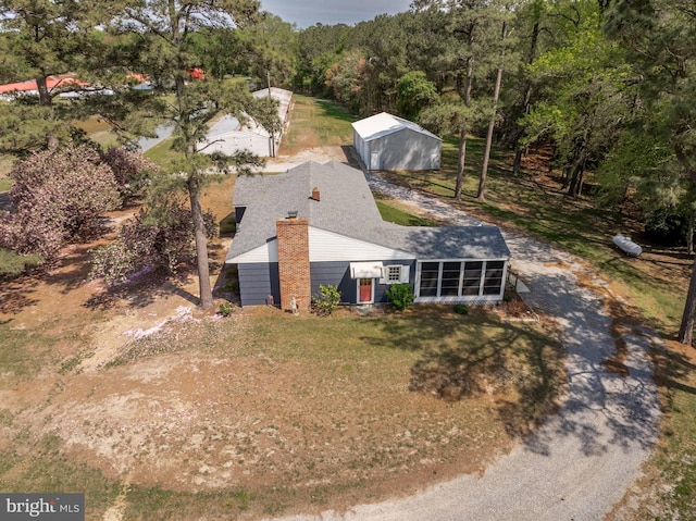 drone / aerial view with a view of trees