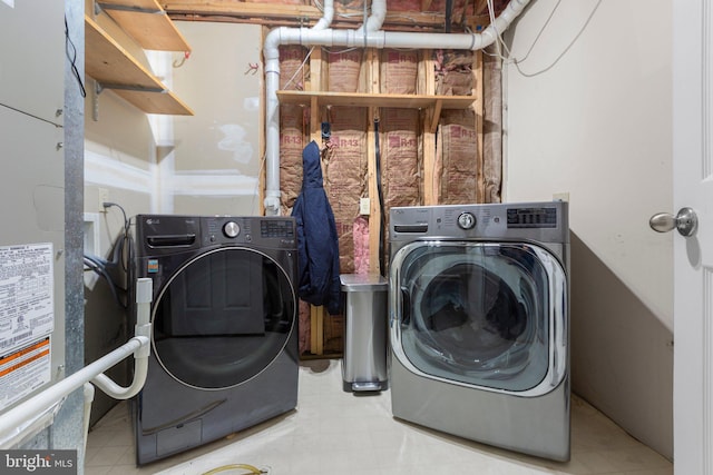 laundry room featuring washer and clothes dryer and laundry area