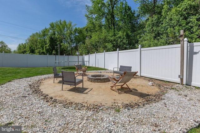view of patio / terrace with a fenced backyard and an outdoor fire pit