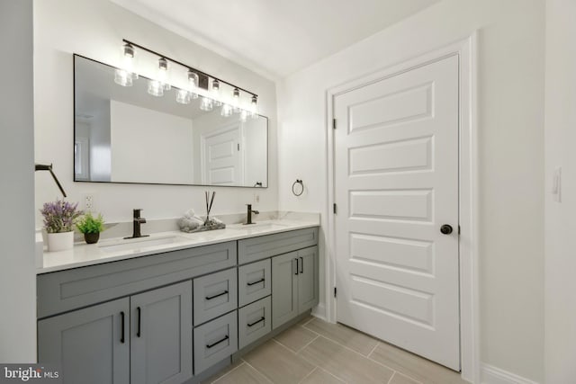 full bath featuring a sink and double vanity