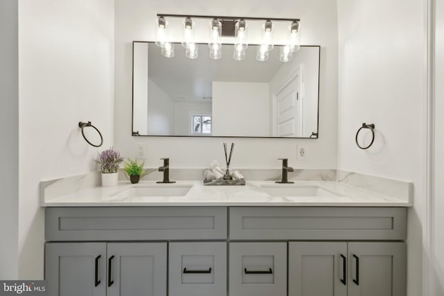 full bath featuring double vanity and a sink