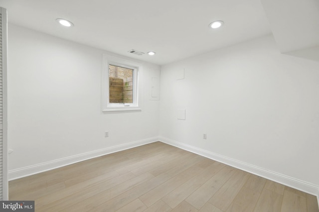 unfurnished room featuring recessed lighting, visible vents, baseboards, and wood finished floors