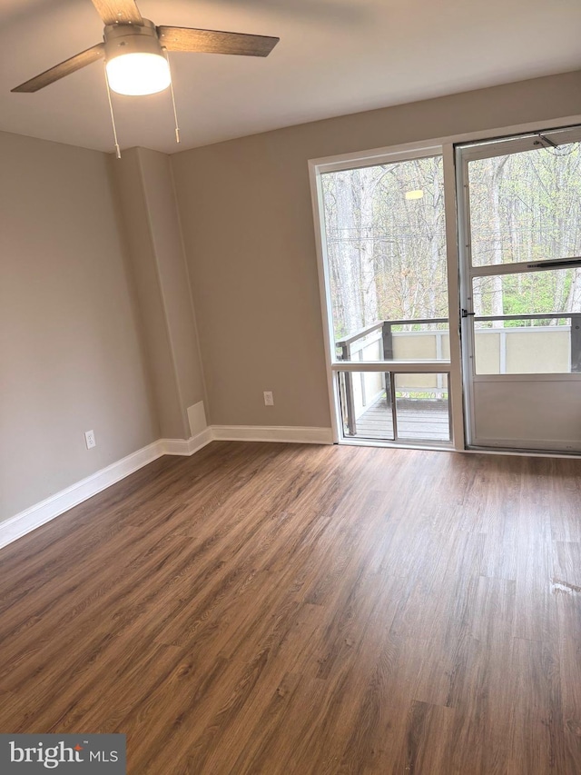 7553 Spring Lake Dr Unit 7553-D, Bethesda, MD 20817 - empty room featuring baseboards, a ceiling fan, and dark wood finished floors