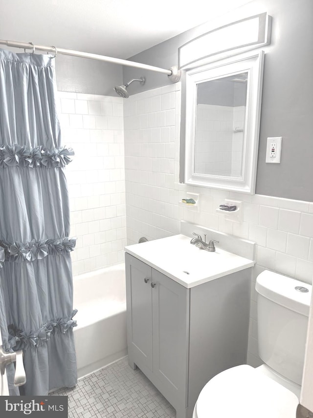 7553 Spring Lake Dr Unit 7553-D, Bethesda, MD 20817 - bathroom featuring vanity, shower / bath combination with curtain, tile walls, and toilet