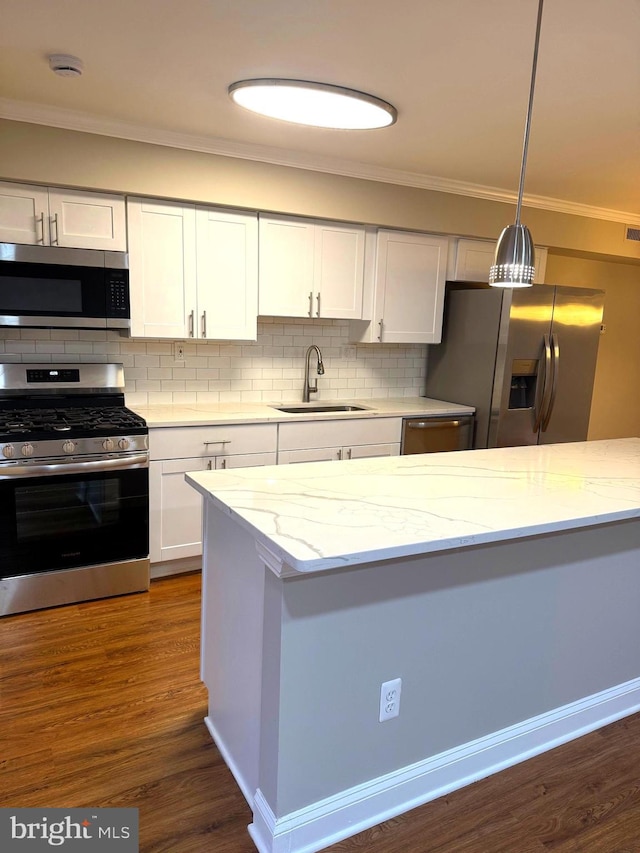 7553 Spring Lake Dr Unit 7553-D, Bethesda, MD 20817 - kitchen with stainless steel appliances, white cabinets, a sink, and ornamental molding