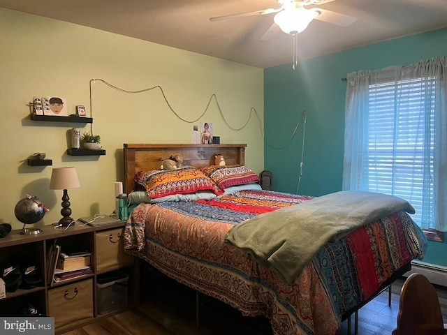 bedroom featuring a ceiling fan and wood finished floors