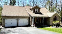 view of front of home with an attached garage and driveway