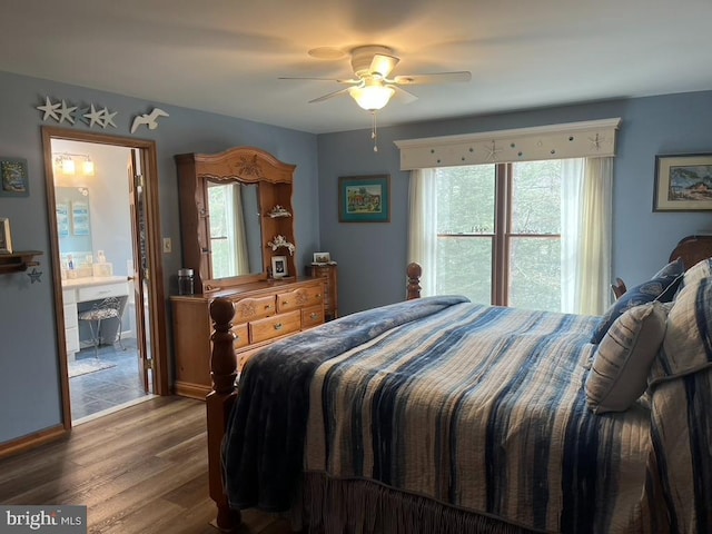 bedroom with a ceiling fan, baseboards, multiple windows, and wood finished floors